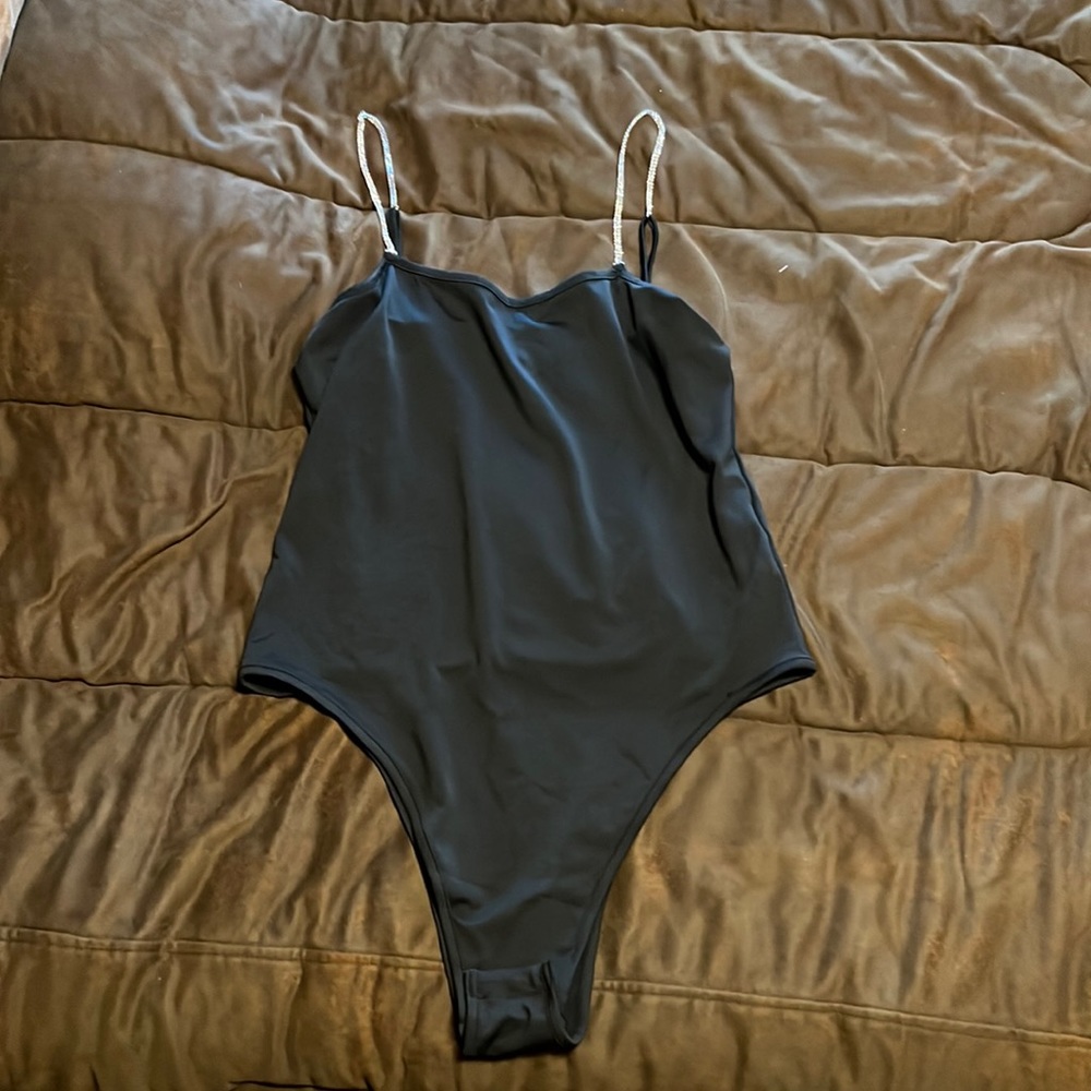 Black bodysuit with rhinestone straps